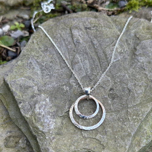 Double circle pendant necklace centre cutout sterling silver chain vintage bread plate recycled restyled artisan jewellery Canadian handmade