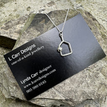 Load image into Gallery viewer, An upside down, cutout paddle pendant swinging from an 18" sterling silver chain and finished with a signature LCarr vintage tag.
