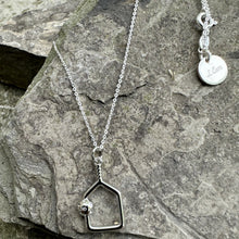 Load image into Gallery viewer, An upside down, cutout paddle pendant swinging from an 18" sterling silver chain and finished with a signature LCarr vintage tag.
