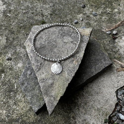 Sterling silver bead stretch bracelet with small circle charm bread plate recycled restyled one of a kind vintage jewellery 