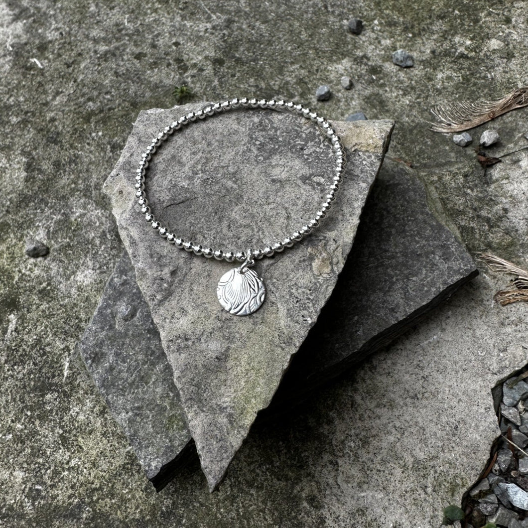 Sterling silver bead stretch bracelet with small circle charm bread plate recycled restyled one of a kind vintage jewellery 