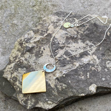 Load image into Gallery viewer, Rhombus diamond brass necklace silver cutout circle sterling chain recycled drum cymbal vintage bread plate the beat goes on handmade wearable musical art
